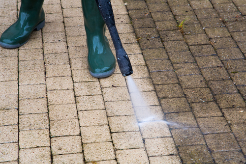 Pressure washers being used on a dirty floor