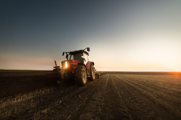 A tractor in a crop field