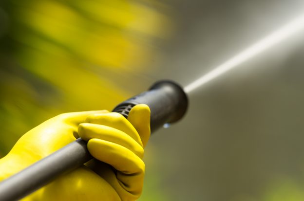 Close-up of a pressure washer in use