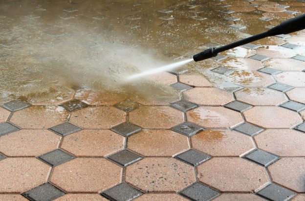 Pressure washing a dirty floor