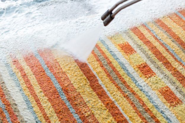Pressure washer being used on a carpet